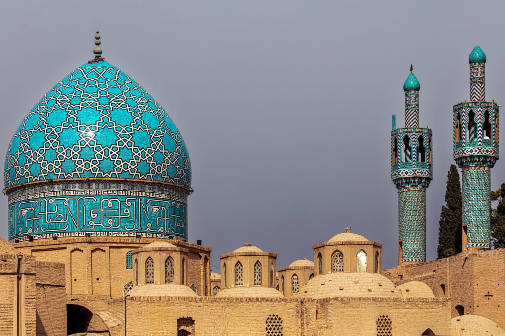 Close-up of Islamic geometric tilework in blue and turquoise