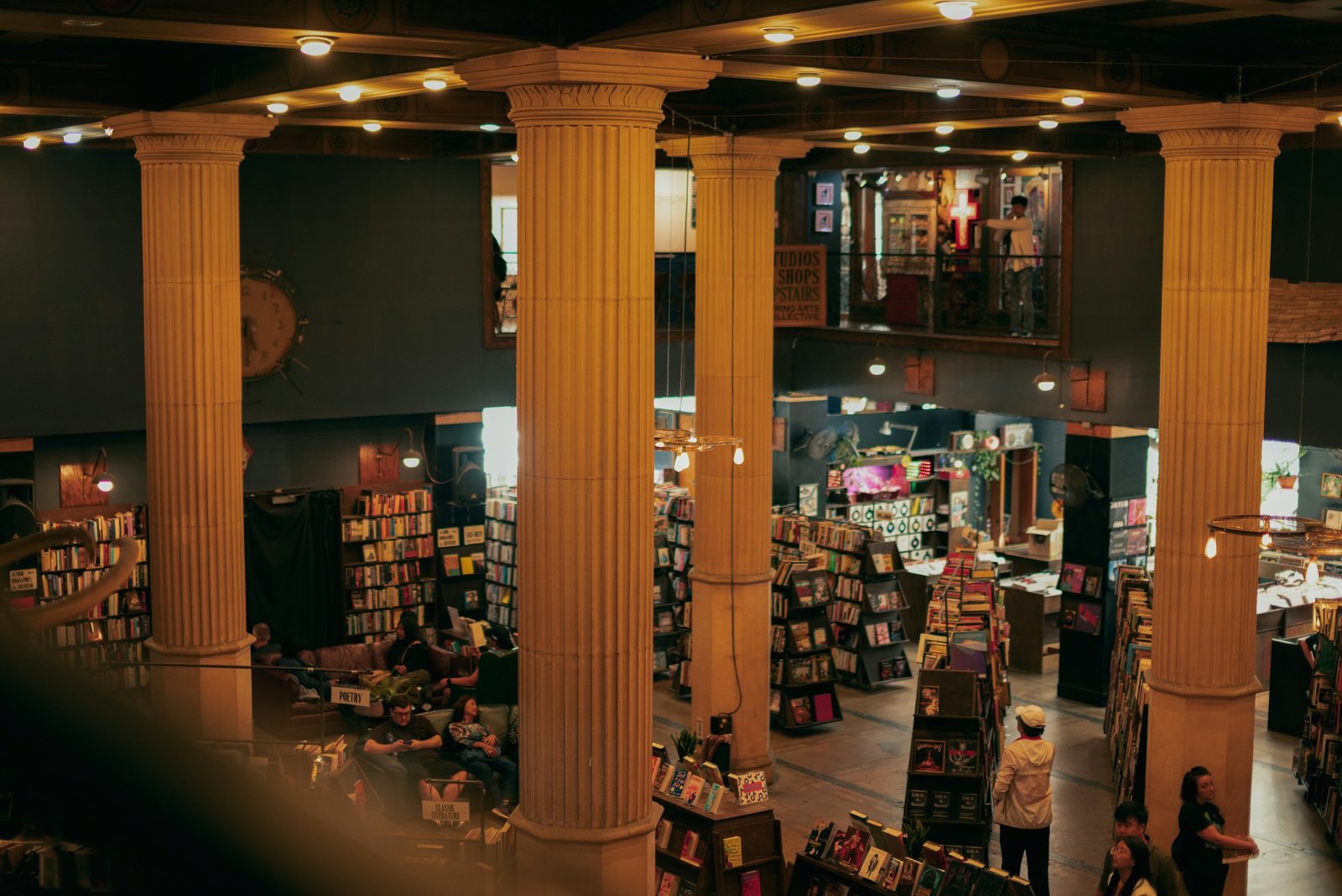 Visitors browsing the aisles of a large book fair