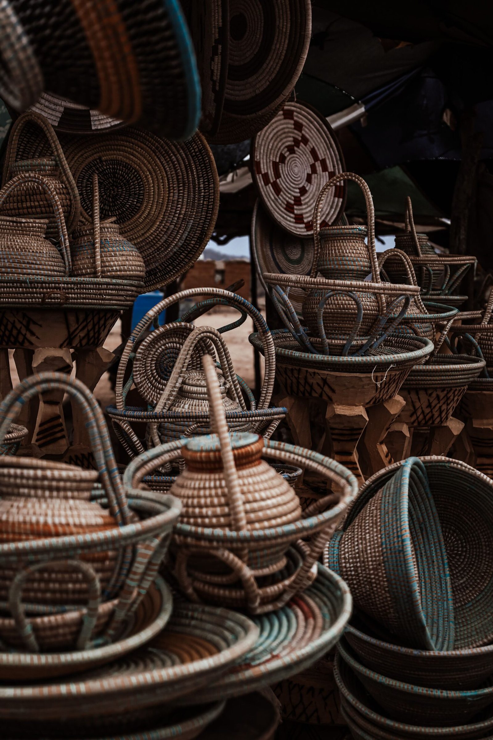 Hand-woven palm-frond baskets stacked at a market stall