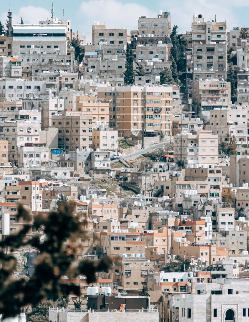 Pale limestone steps between stone walls in an old part of Amman