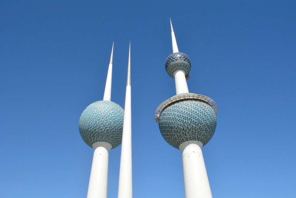 The Kuwait Towers rising against a clear blue sky in Kuwait City