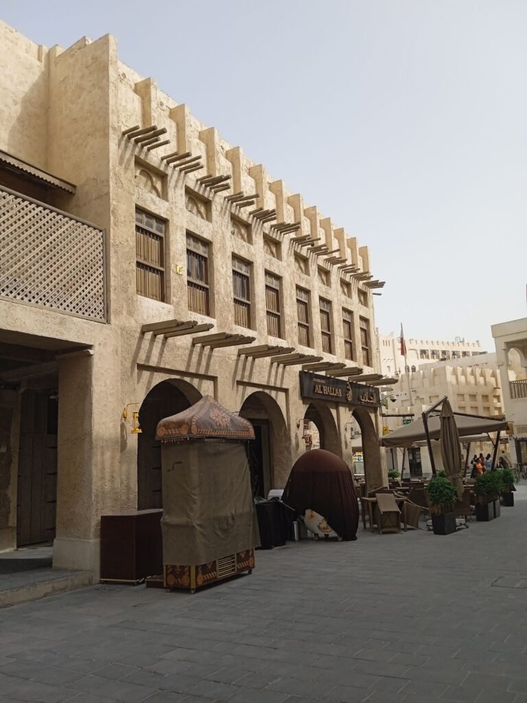 A shaded lane with earthen walls in Souq Waqif, Doha