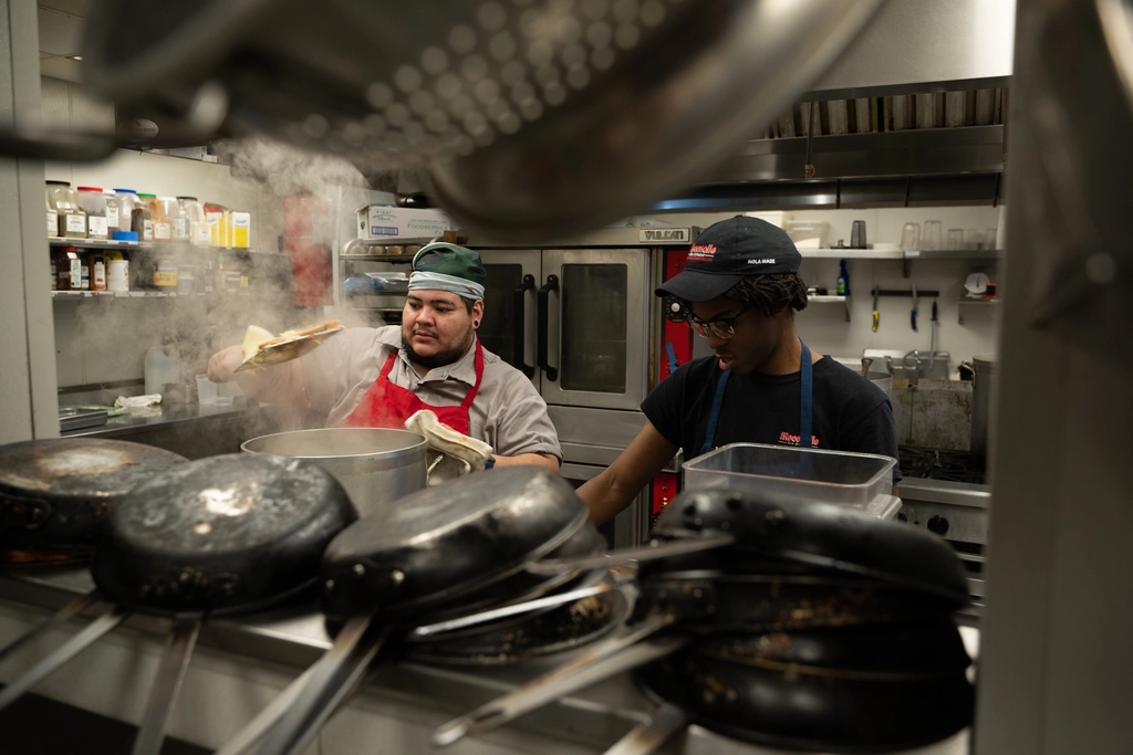 Chefs working in a restaurant open kitchen
