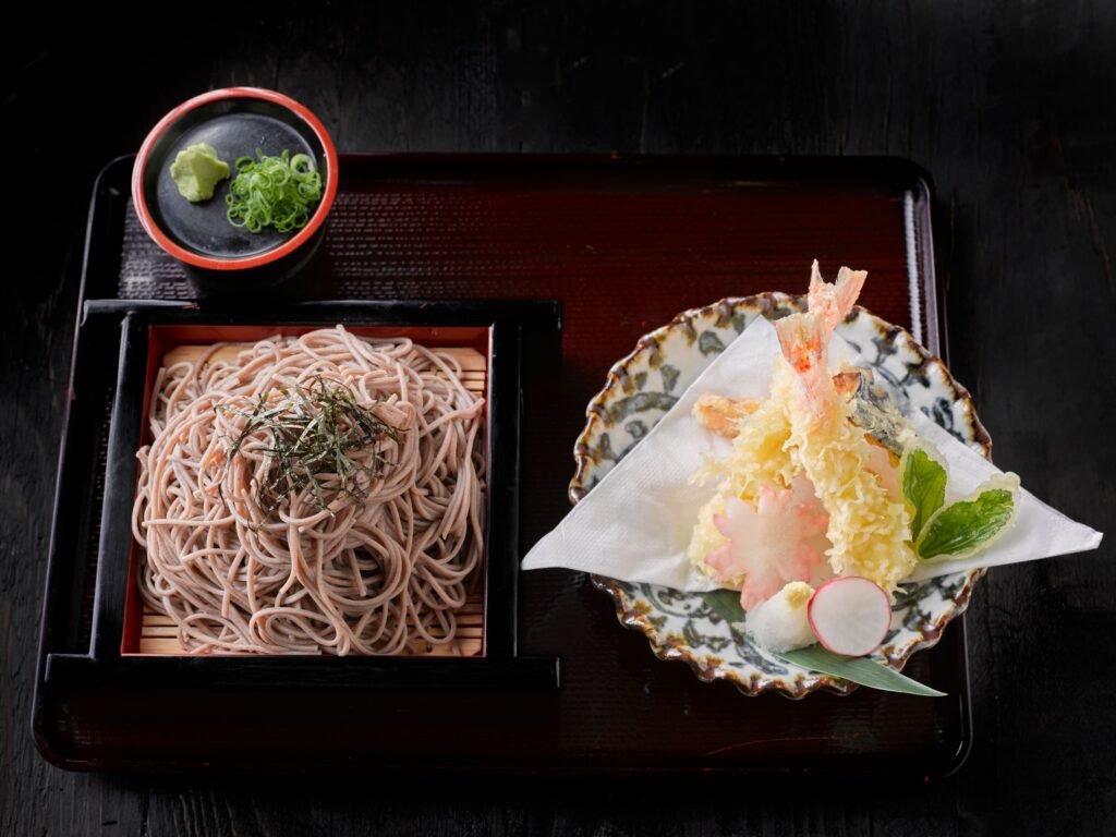A bowl of udon noodles with tempura