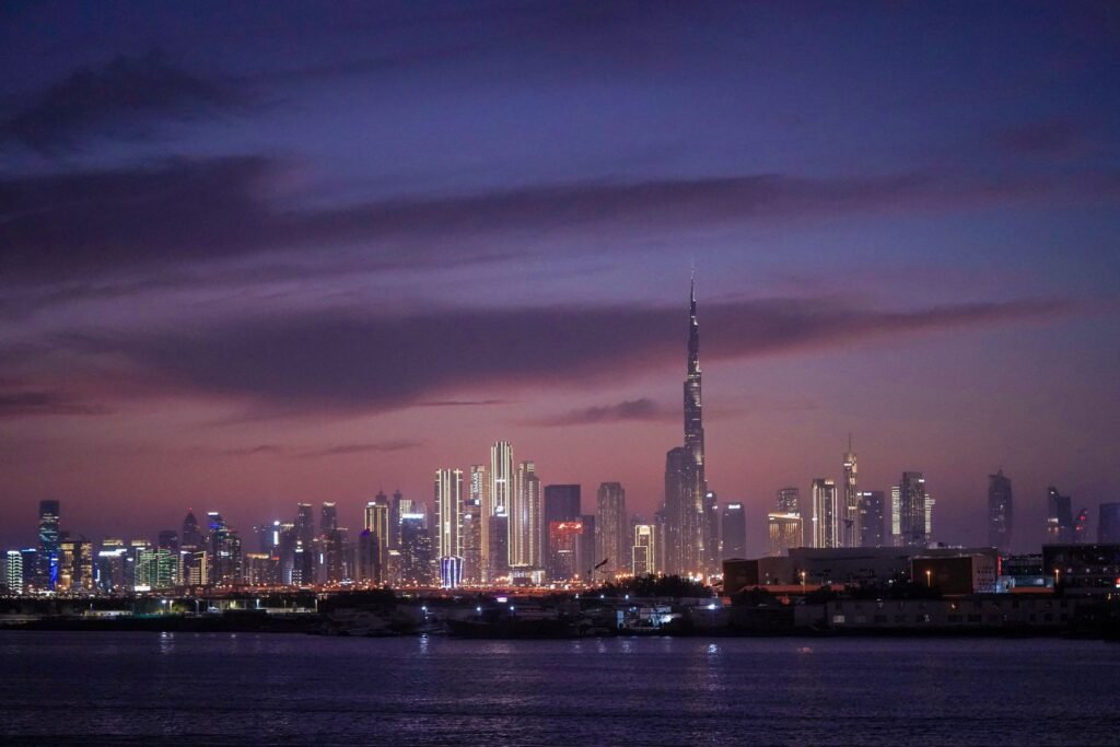 The Dubai skyline at dusk seen from the water