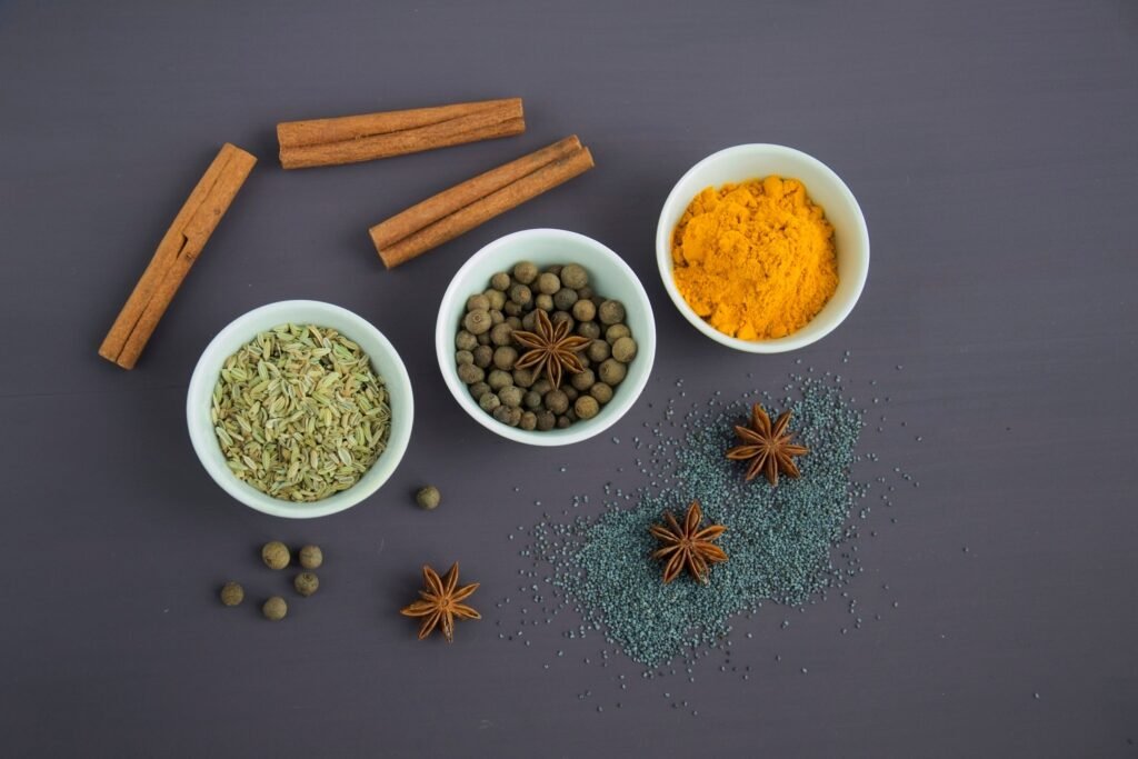 Red pepper flakes and spices in small bowls