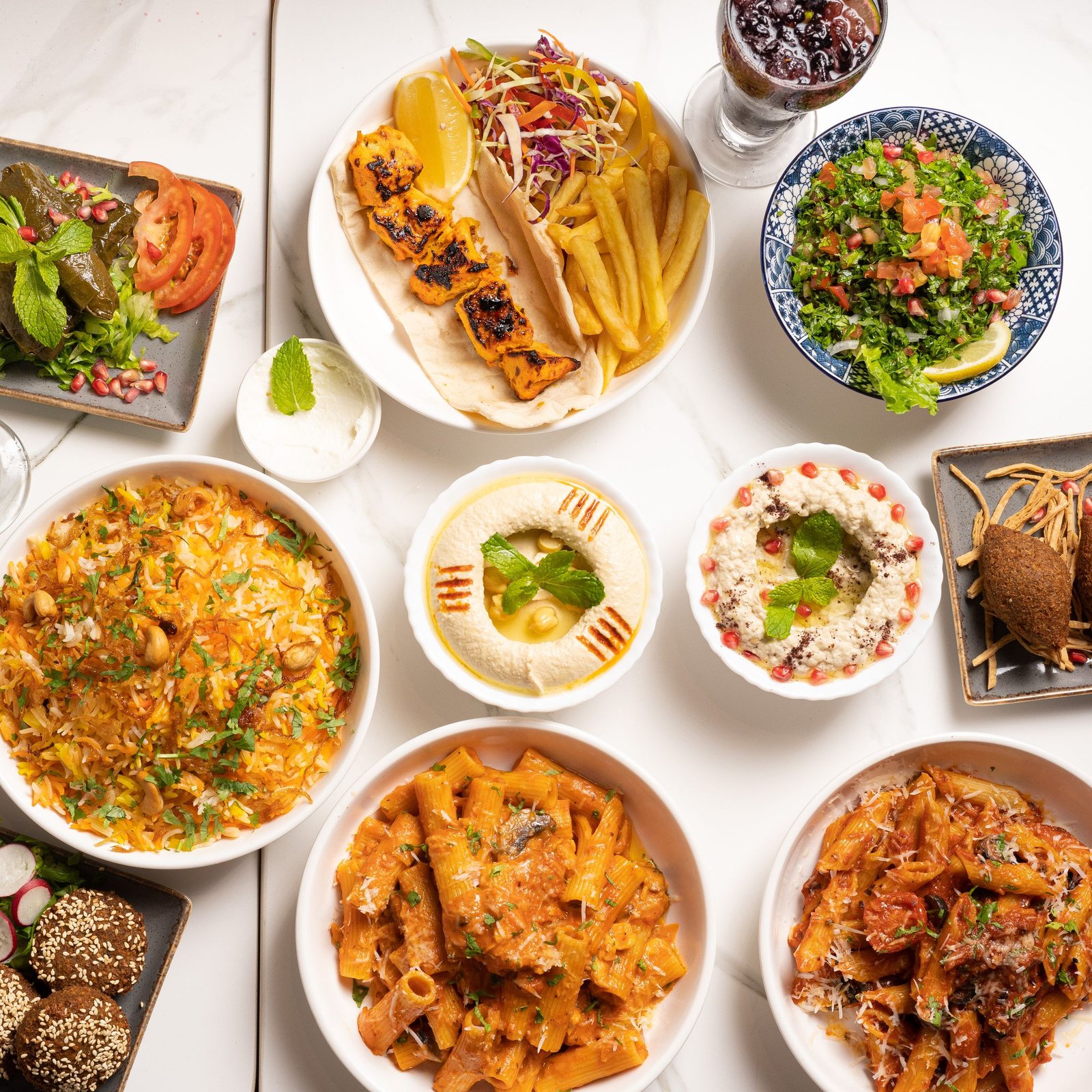 A spread of Levantine mezze dishes on a wooden table