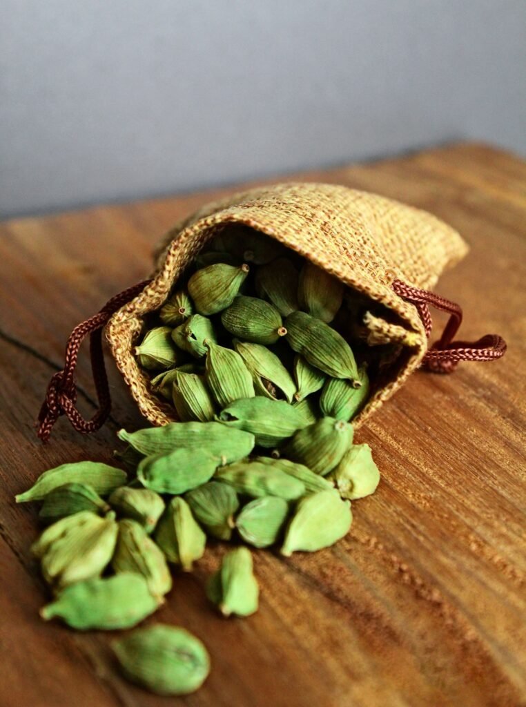 Cardamom pods and saffron threads on a tray