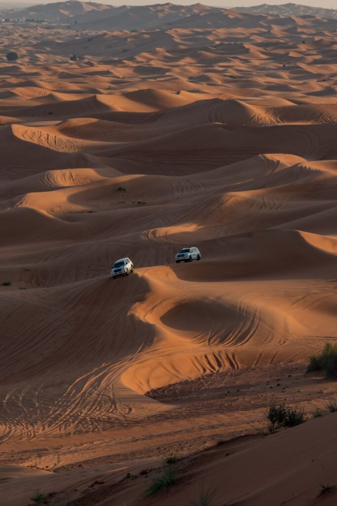 A convoy of off-road vehicles crossing the desert