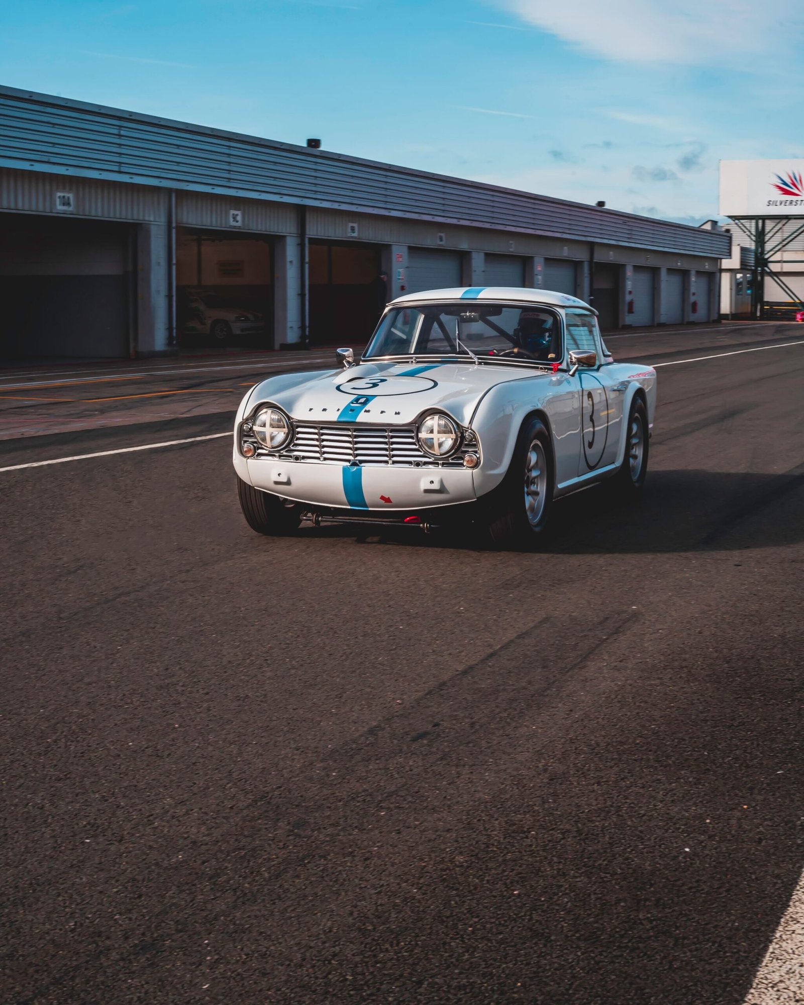 A classic Porsche 911 seen from the rear three-quarters
