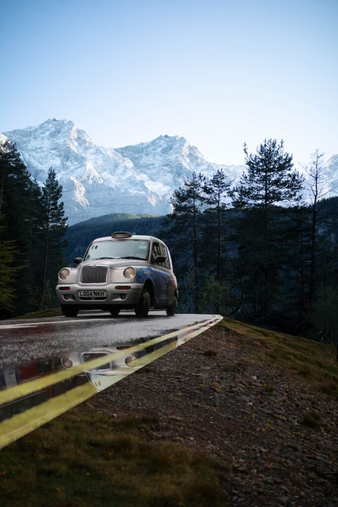 A Porsche 911 on a winding mountain road