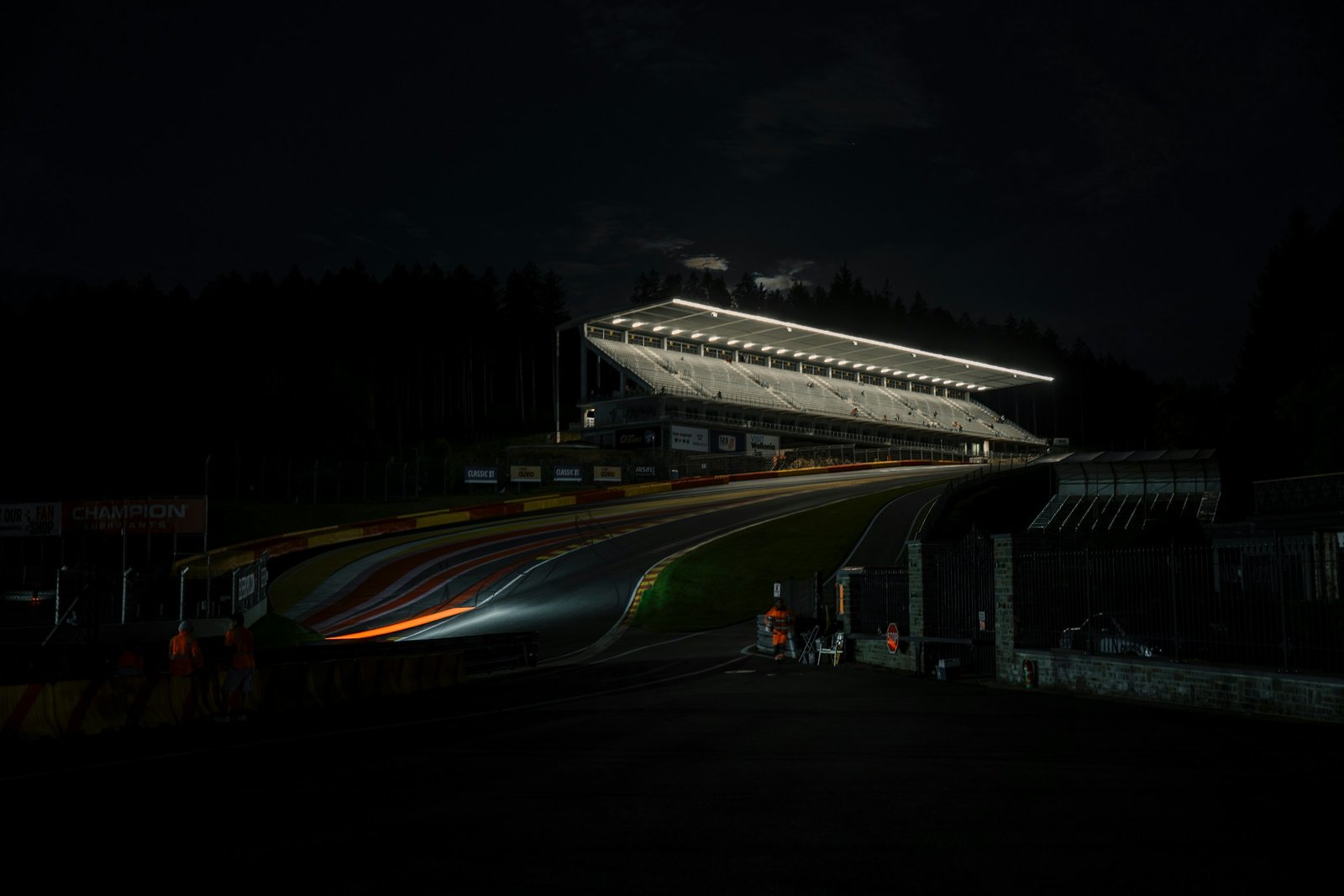 A racing circuit lit by floodlights at night