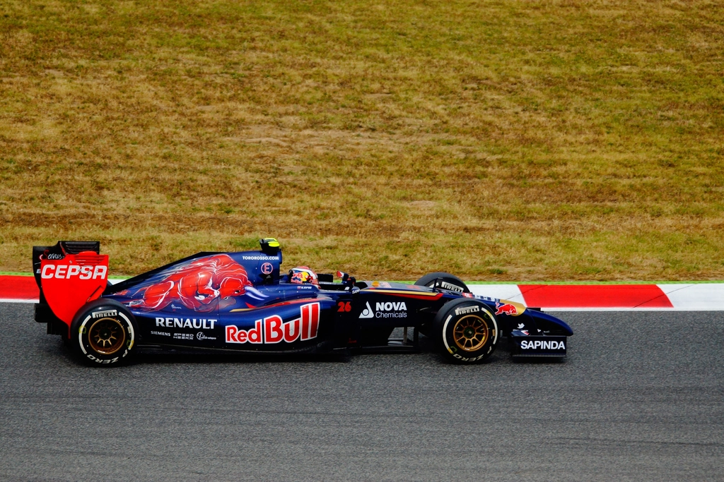 A Formula 1 car at speed on a race circuit