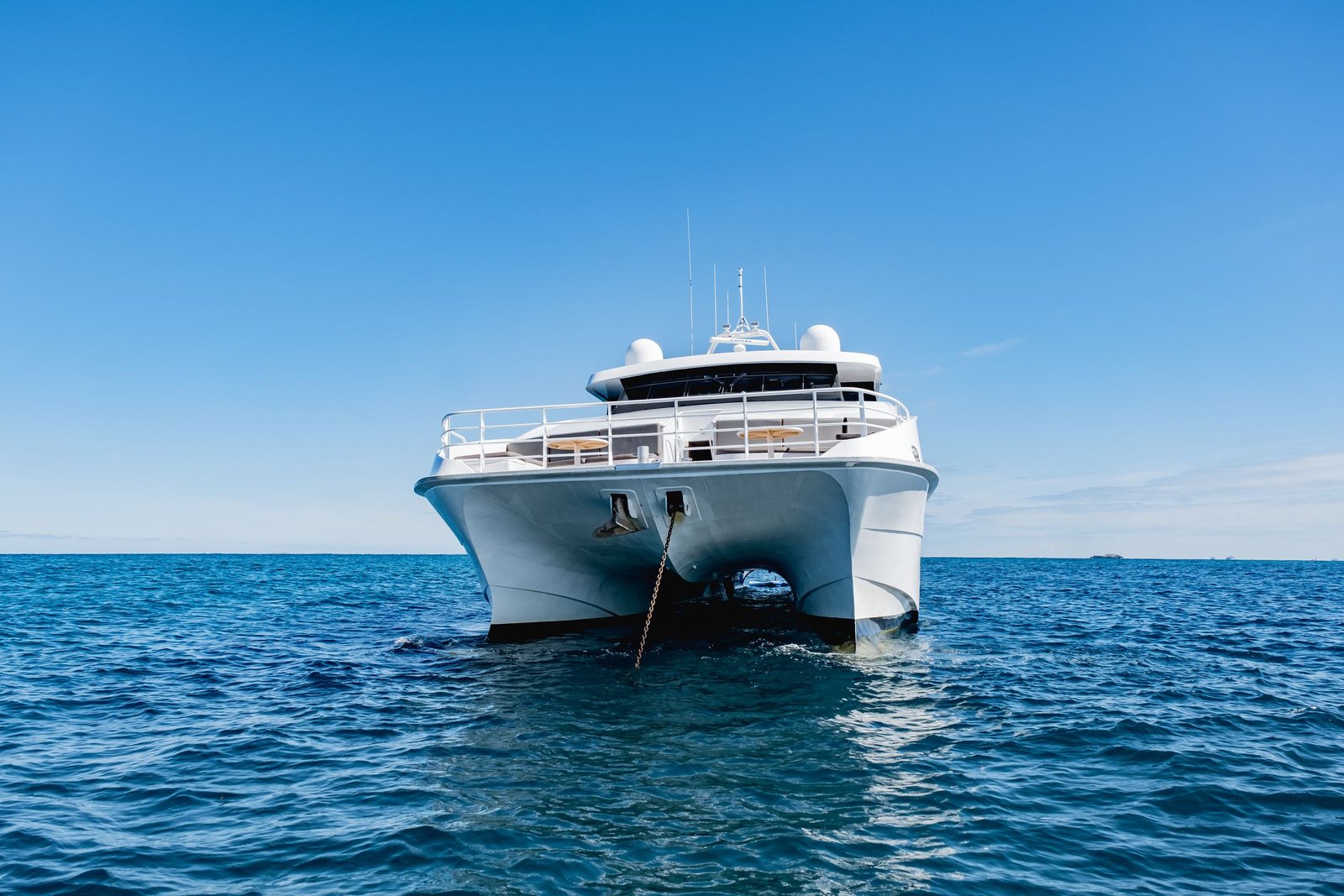 A large motor yacht cruising on open water off a Gulf coast