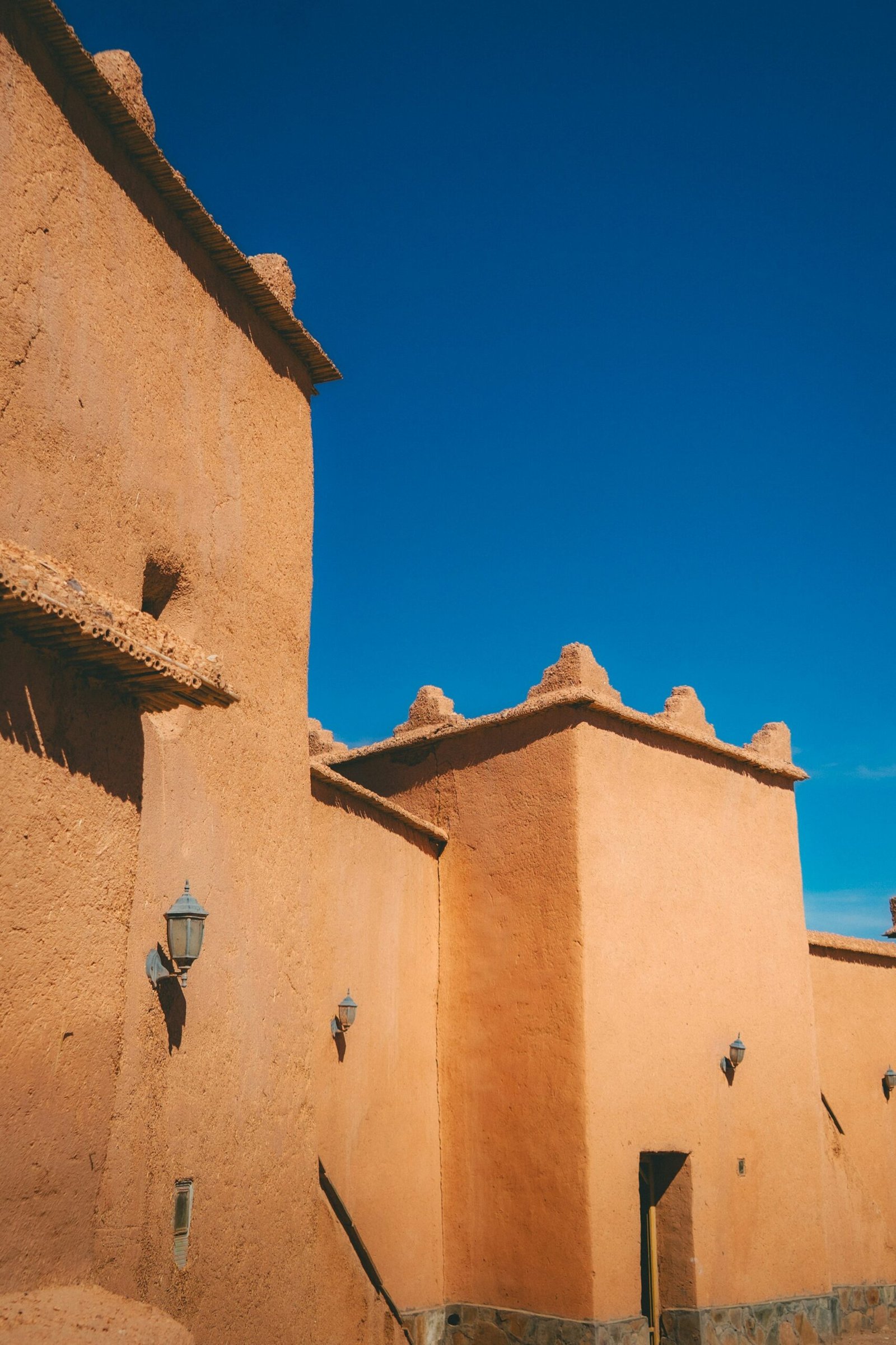Earthen walls against a clear blue sky