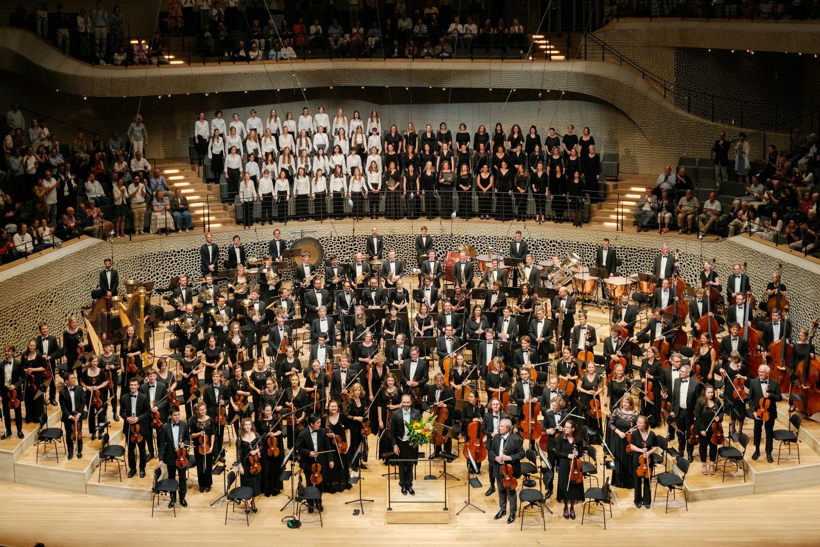 A symphony orchestra on a concert hall stage