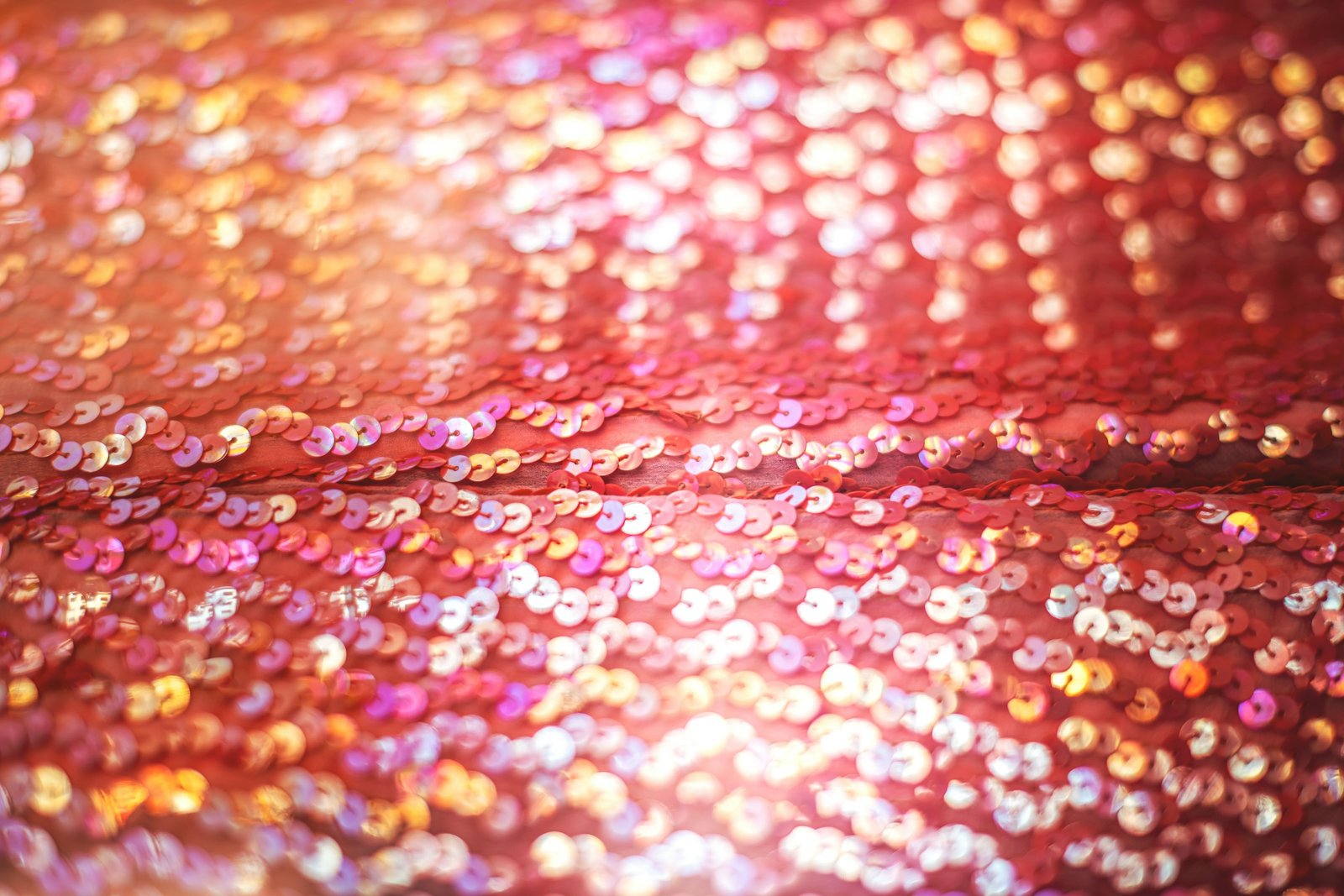 Close-up of hand-beaded embroidery and sequins on evening fabric