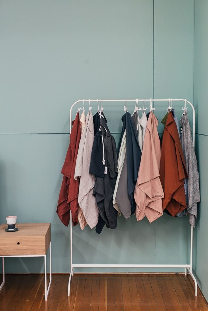 Dresses hanging on a rail in a backstage dressing area