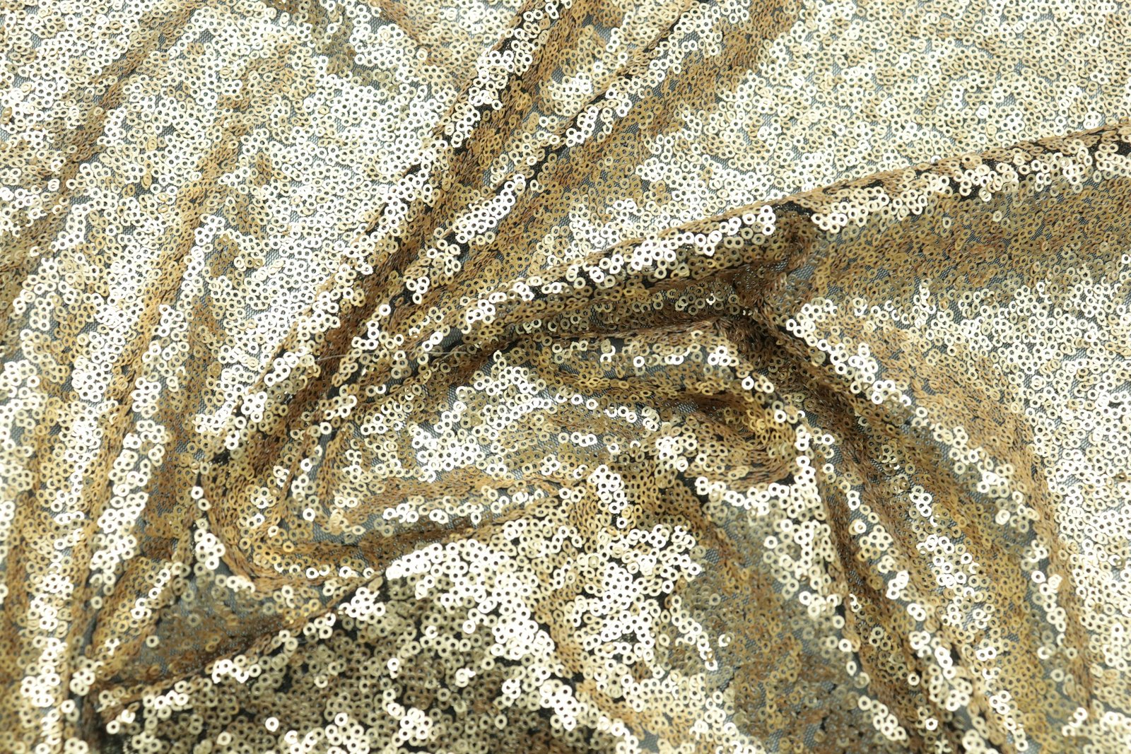 Close-up of sequin and lace embroidery on fabric