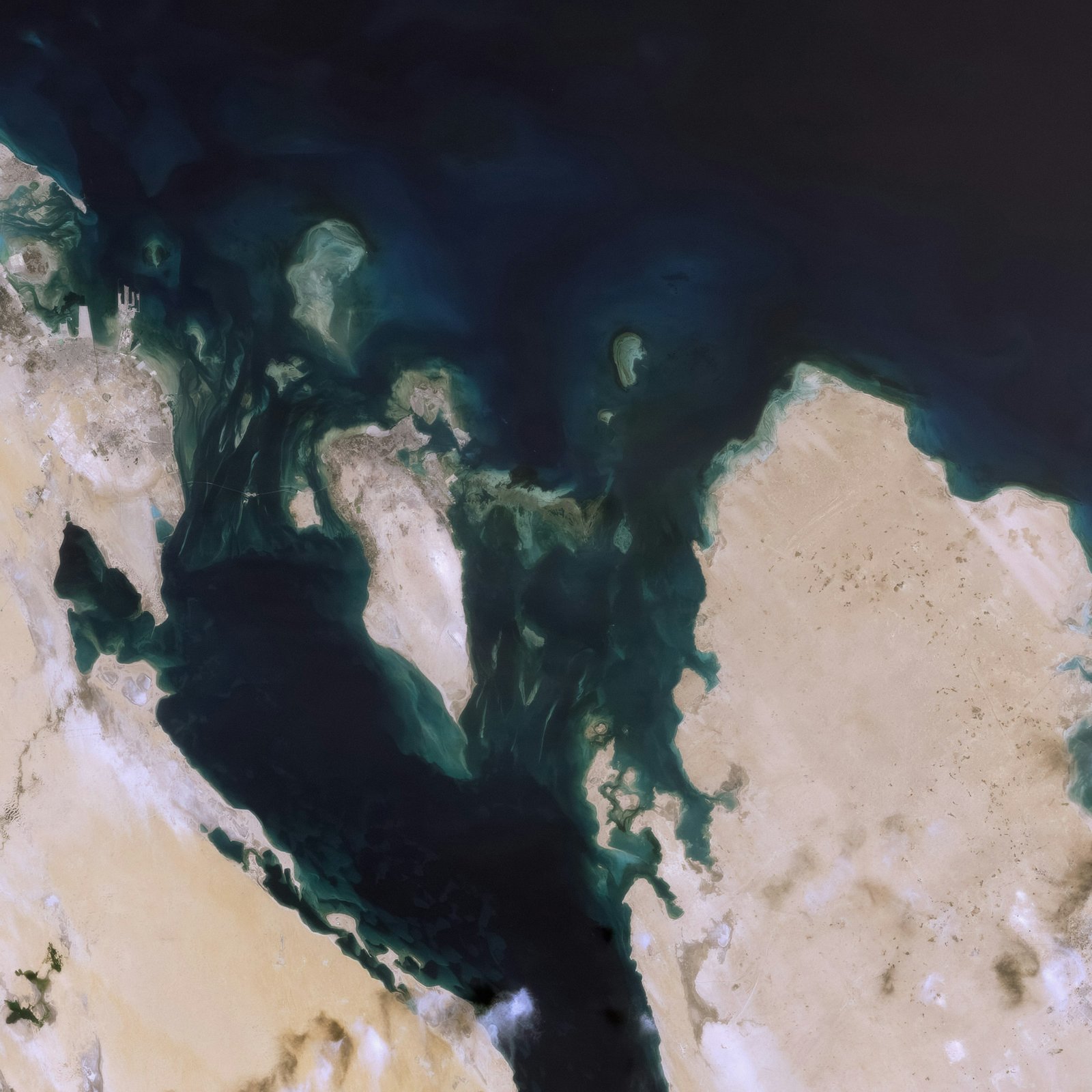 Turquoise shallows and a coral reef seen from above on the Red Sea coast