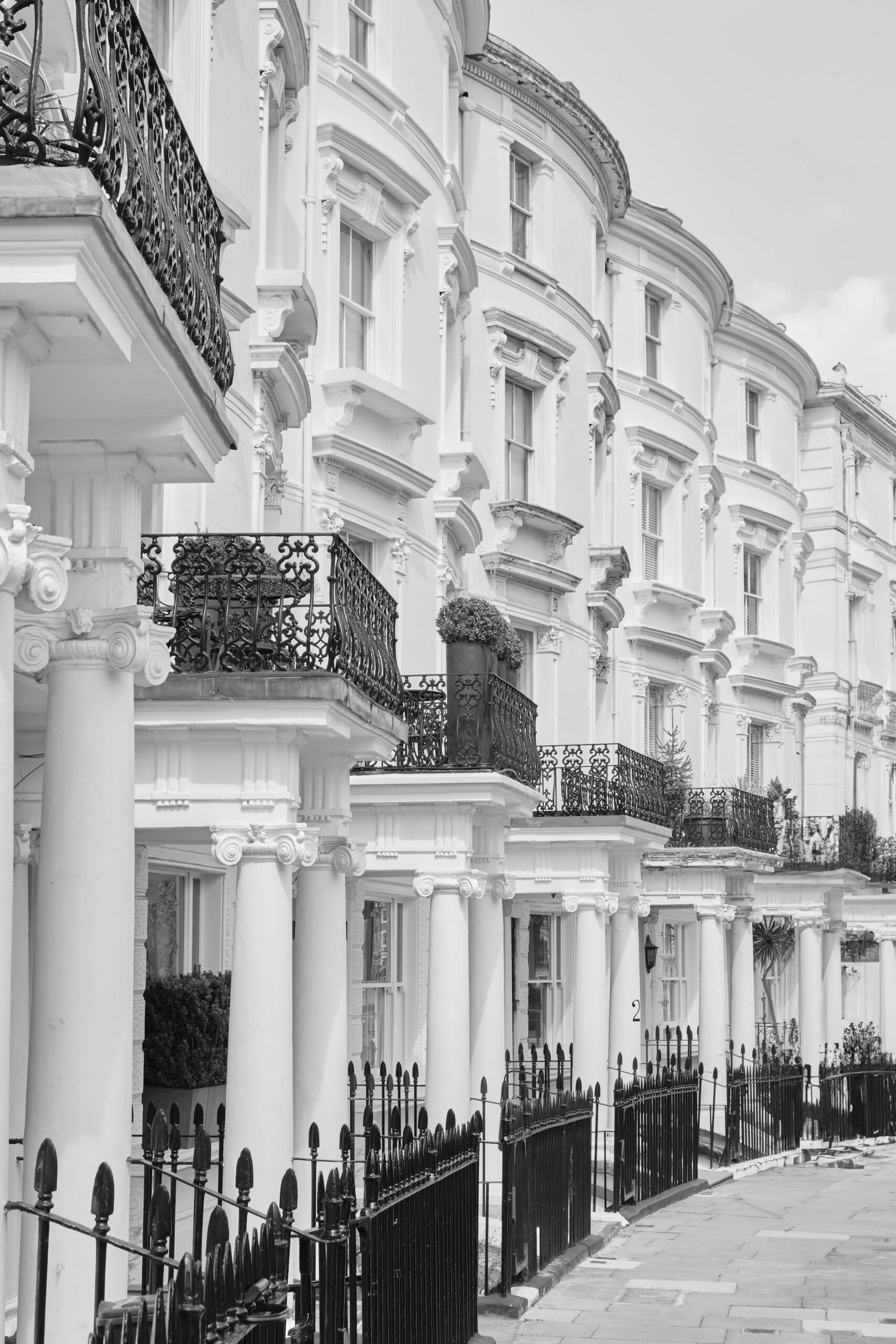 Georgian townhouse facades with tall sash windows on a London street