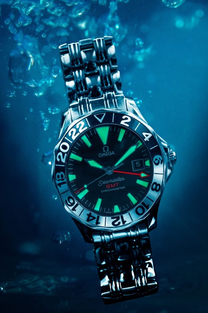 A dive watch submerged in clear water