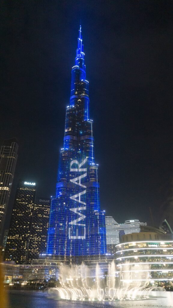 Downtown Dubai towers lit up at blue hour
