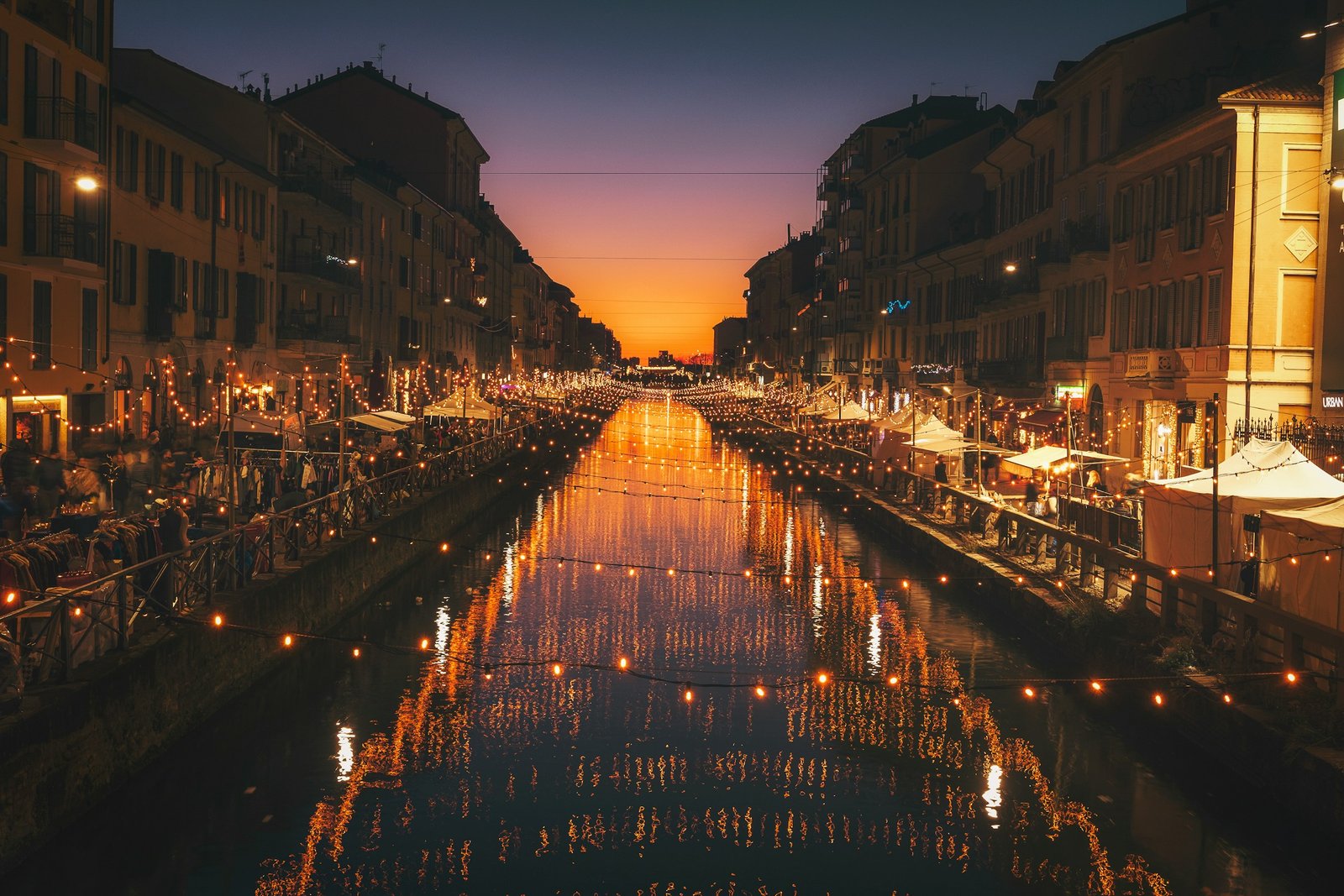 Lights reflected in the Navigli canal in Milan at night