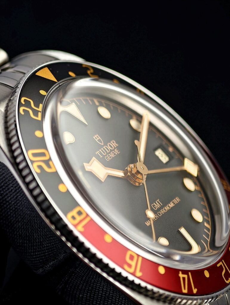 Close view of a GMT watch dial with its fourth hand