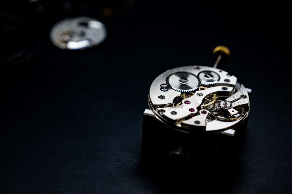 Close-up of a mechanical watch movement with its balance wheel and gears