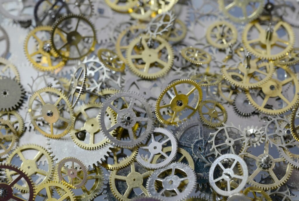 Macro view of small metal gears and wheels taken from old watches