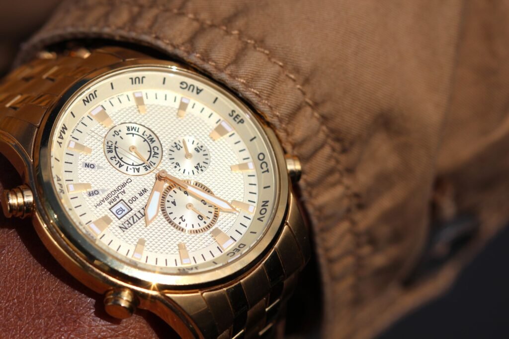 A gold chronograph with a date display, photographed close up