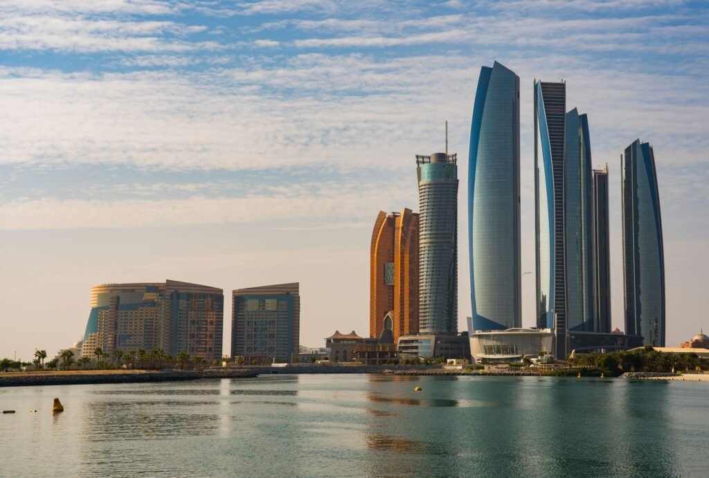 Modern towers along the Abu Dhabi waterfront on a clear day