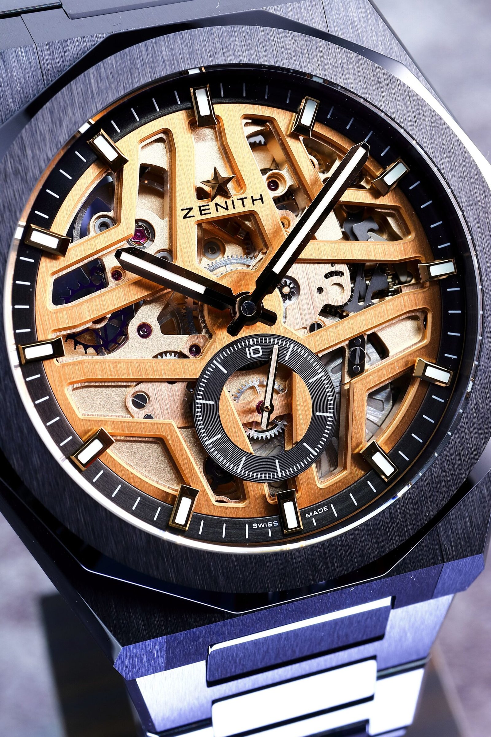 A Swiss watch with an intricate skeleton dial showing its gears